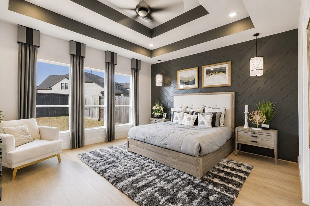 Styled primary bedroom with warm lighting